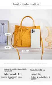 Detail of yellow PU handbag featuring embossed heart and dog patterns with strap