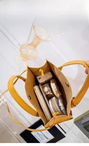 Top view of yellow leather tote bag interior showing large capacity for daily items