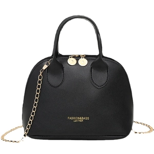 Classic black leather shell handbag with gold chain strap and dual top handles