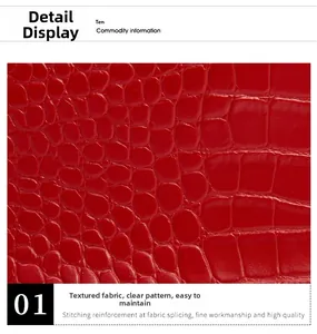 Close-up of red crocodile embossed texture on a chain bag with clear glossy grain detail