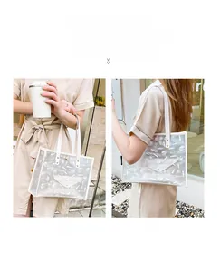 Detail of transparent PVC tote bag with cosmetic prints and white inner pouch
