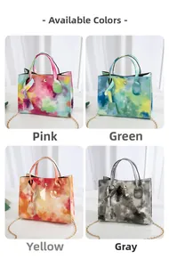 Detail view of tie-dye tote handbags in pink, green, yellow and grey with gold chain straps