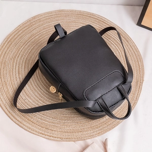 Minimalist black quilted PU leather mini backpack with golden zipper and adjustable straps