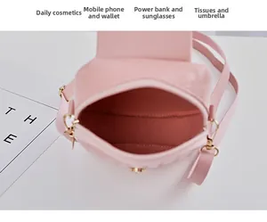 Pink quilted mini bag interior showing single compartment storage and magnetic closure