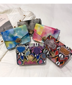 Collection of snake pattern crossbody bags with chain straps and metallic buckles
