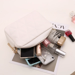 Quilted white square chain bag for women showing large capacity for daily items