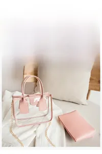 Detailed view of pink composite PVC tote bag with gold chain and matching inner pouch