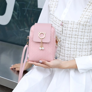 Pink woven mini crossbody bag with cat ear hardware and pearl fringe for women
