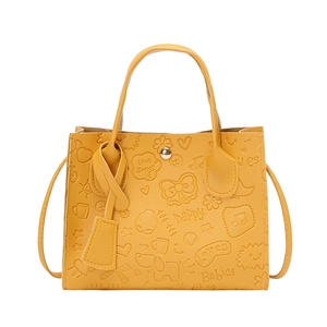 Bright yellow embossed tote bag with cartoon patterns and detachable shoulder strap