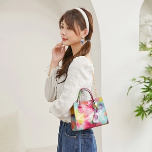 Fashionable watercolor crossbody handbag with gold chain strap and smooth glossy finish
