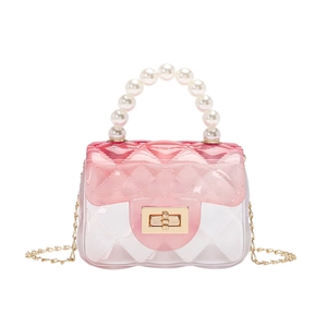 Mini pink gradient jelly bag with pearl handle and quilted pattern on white background