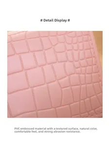Detailed macro view of pink crocodile-embossed PVC material with durable texture