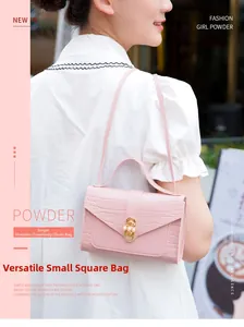 Pink crocodile-embossed mini square bag with elegant golden pearl twist lock closure