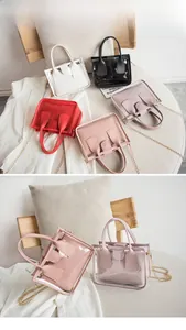 Detailed view of clear PVC crossbody bags with chain straps in five vibrant colors