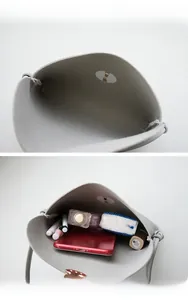 Internal view of minimalist grey crossbody bag showing large capacity for essentials
