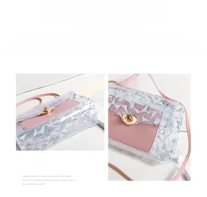 Detail of transparent geometric crossbody bag with pink leather flap and gold hardware