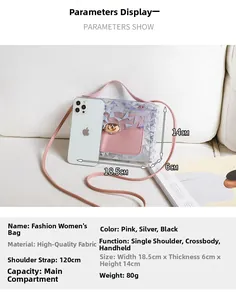 Close-up of pink laser geometric mini crossbody bag with dimensions shown against a phone