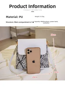 Internal view of snake pattern bucket bag showing capacity for phone and cosmetics