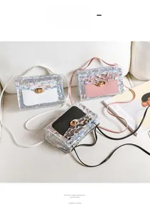 Three transparent PVC crossbody bags with laser geometric patterns on a white sofa