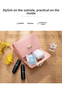Close-up of pink croc-pattern mini bag showing interior space for lipstick and perfume