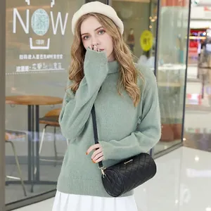 Mini black quilted barrel crossbody bag with gold chain strap for stylish women