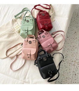 Detailed close-up of compact PU leather crossbody bags in five stylish colors with B-logo