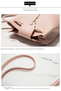 Close-up detail of a minimalist pink bucket bag featuring a secure closure and slim strap