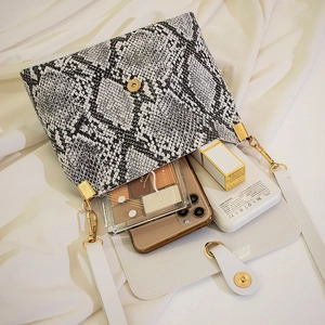 Snake skin pattern crossbody bag for women with gold clasp and daily essentials