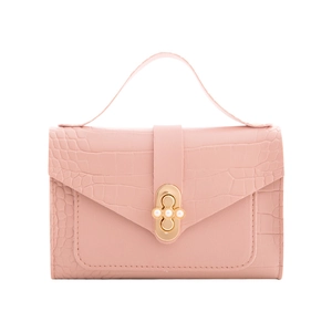 Pink crocodile-embossed mini handbag with a gold pearl twist lock clasp on white background