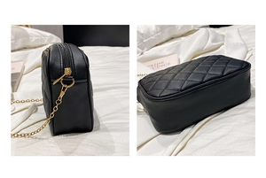 Detail view of black quilted chain shoulder bag featuring gold zipper and side profile