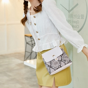 Chic mini snake print bucket bag for women with white leather flap and gold hardware