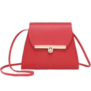 Minimalist red crossbody square bag featuring a modern gold rectangular metal clasp lock