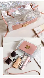 Macro detail of holographic crossbody bag showing the spacious main and front pocket