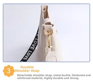 Detail of crocodile pattern leather bag with detachable LOVE jacquard strap and gold hardware