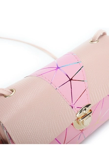 Detail of pink faux leather crossbody bag with geometric patterns and gold twist lock