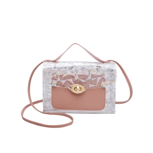 Pink transparent PVC crossbody bag with geometric texture and gold twist-lock closure