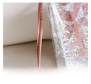 Detail of pink leather strap with precise stitching and colorful sequin texture