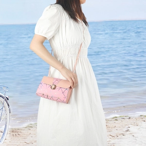 Pink geometric pattern crossbody bag for women with gold clasp and leather shoulder strap