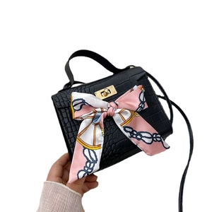 Classic black crocodile pattern handbag with silk scarf and golden twist lock closure