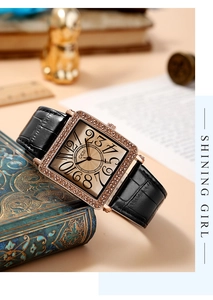 Detail of vintage square watch with diamond bezel on retro book background