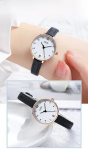 Detail view of GEDI minimalist watch with rose gold case and black leather strap
