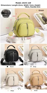 Litchi pattern crossbody bag showing triple zipper compartments and wide shoulder strap