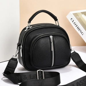 Chic black lychee grain multi-zipper handbag with decorative wide nylon shoulder strap