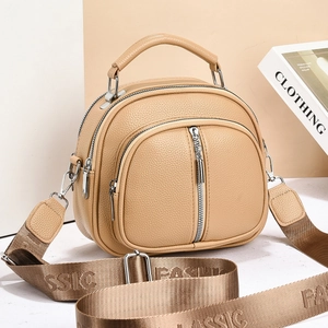 Khaki pebbled leather shoulder bag with wide fashion strap and curved zip pocket