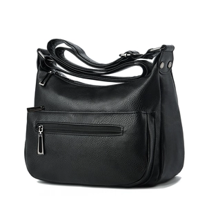 Black pebbled leather tote bag with silver zippers and adjustable shoulder strap