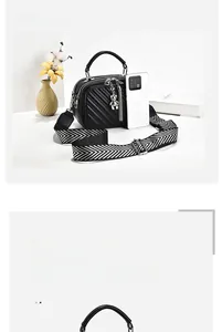 Detail view of black quilted square shoulder bag with herringbone strap and tassel