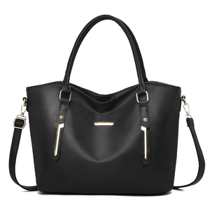 Black pebbled leather tote bag with gold metal trim and adjustable strap for women