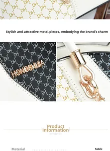Close-up of black and white fabric tote with gold hardware and detailed stitching