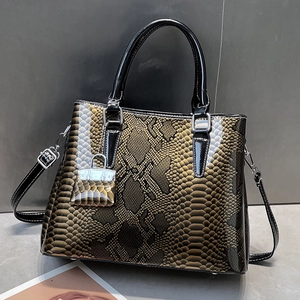 Retro faux snake skin handbag with top handle and shoulder strap in dark brown
