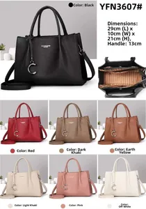 Litchi pattern PU leather tote bag with metal pendant and internal zippered compartments